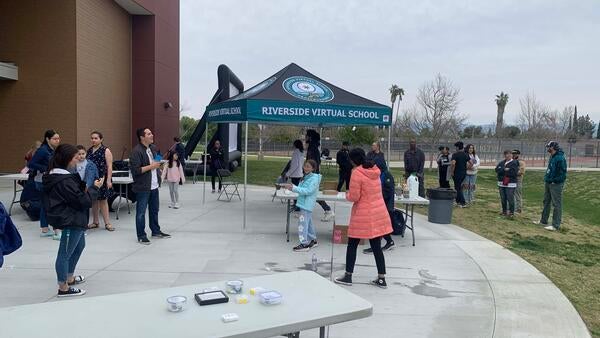 Members of the public play with bottle rockets at Arlington High School. 